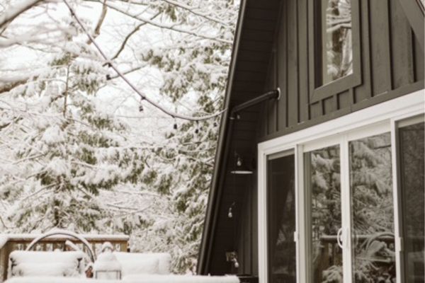 exterior of the aframe in snowy weather