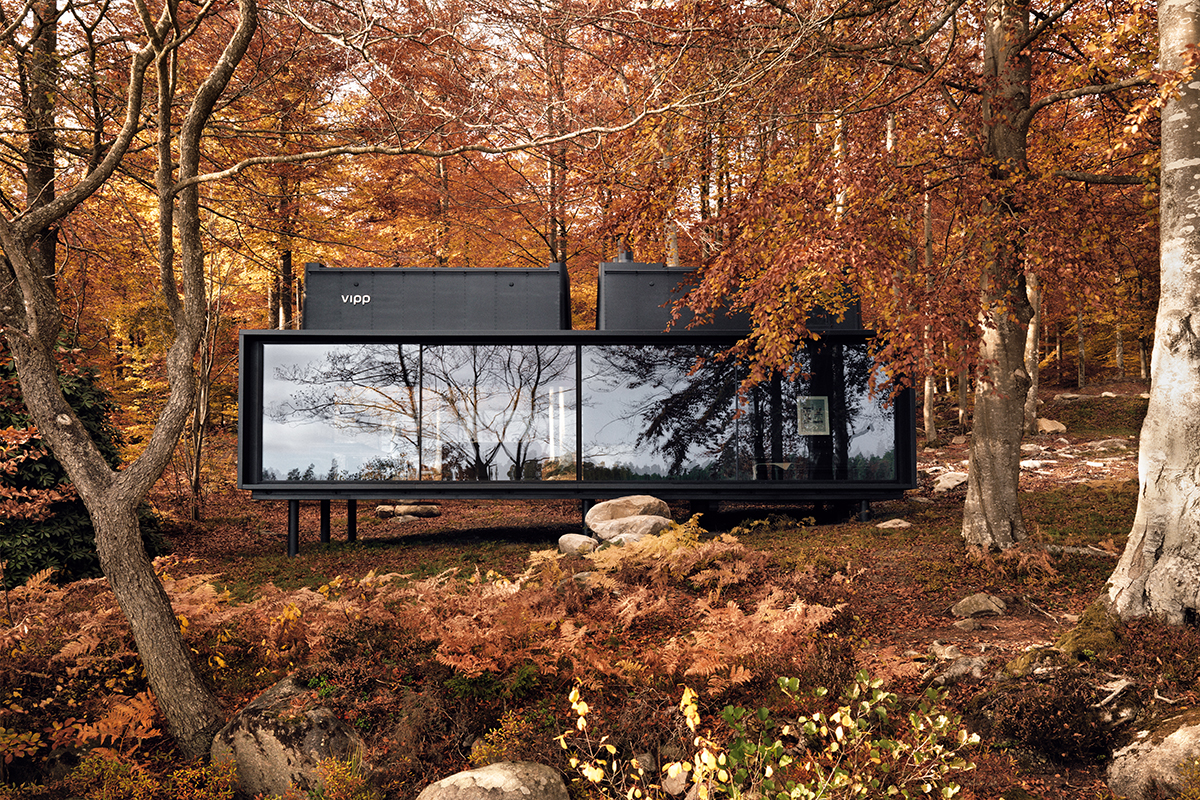 vipp shelter black rectangular cottage in autumn forest, colin and justin's escapology