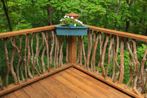 Twig, Mountain Laurel railing, secures the wood railing of a deck with corner flower box in North Carolina mountains