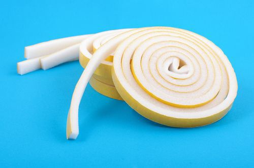 Sealing tape for windows and doors in a roll isolated on blue background