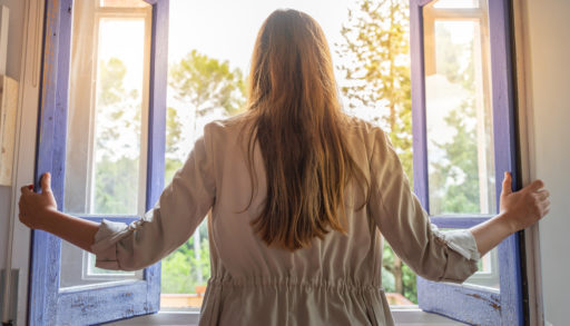 Woman opening window