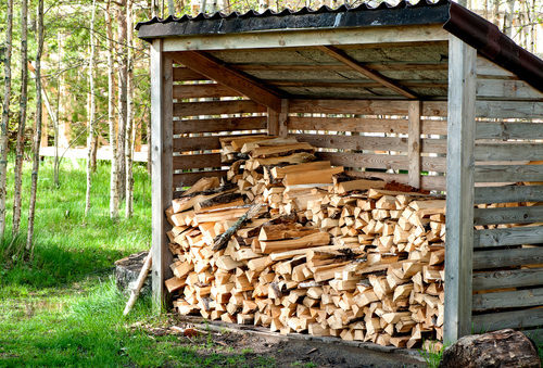 shed for storing firewood with dry firewood.