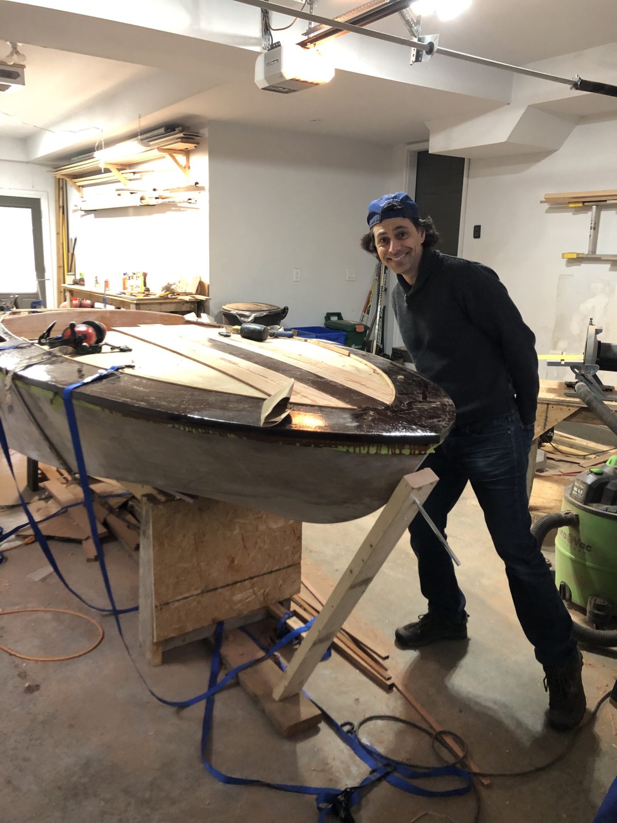 Man standing with DIY boat