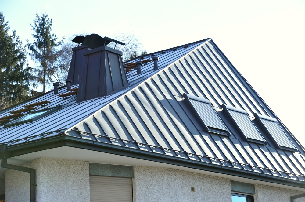 A steel roof with roof windows and fume hoods.