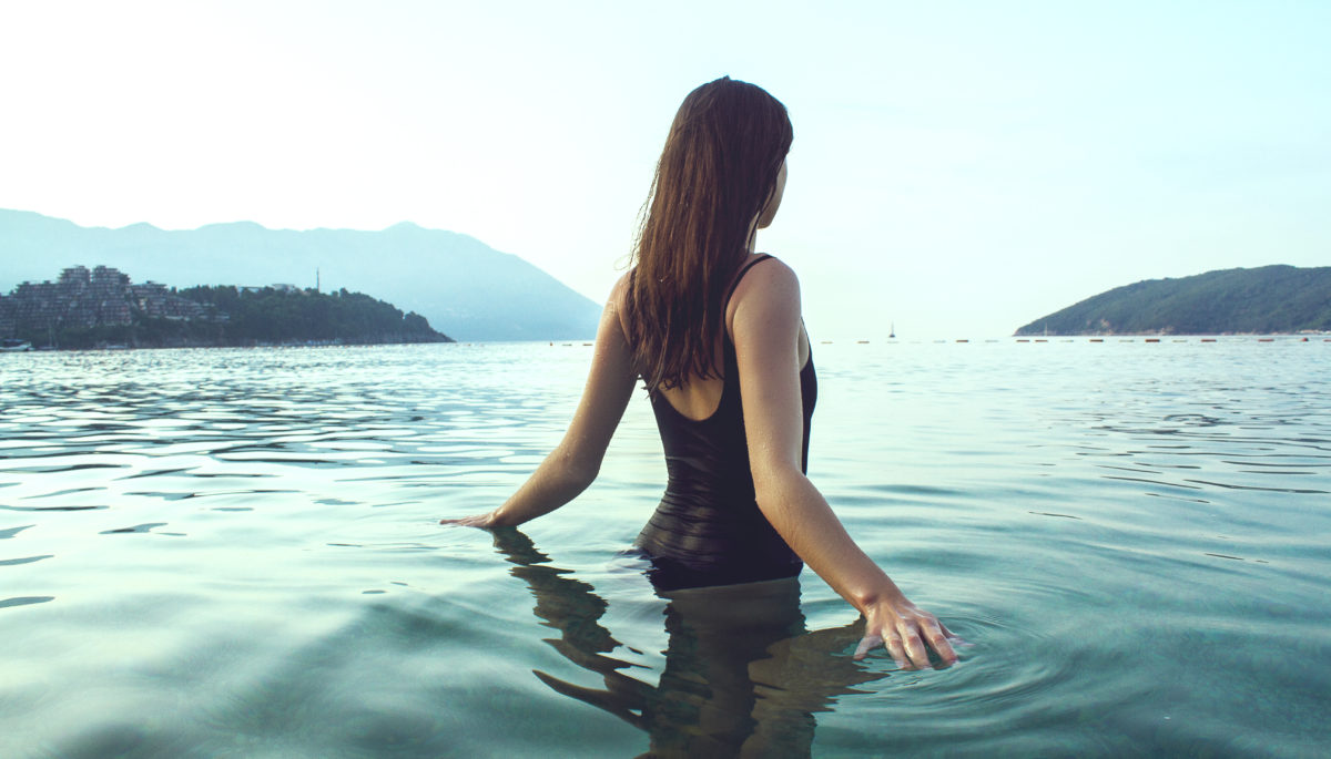 woman in lake in bathingsuit