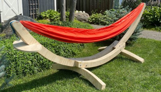 red hammock on a diy hammock stand made out of a single sheet of plywood