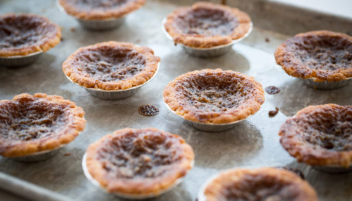 Butter tarts on a baking sheet