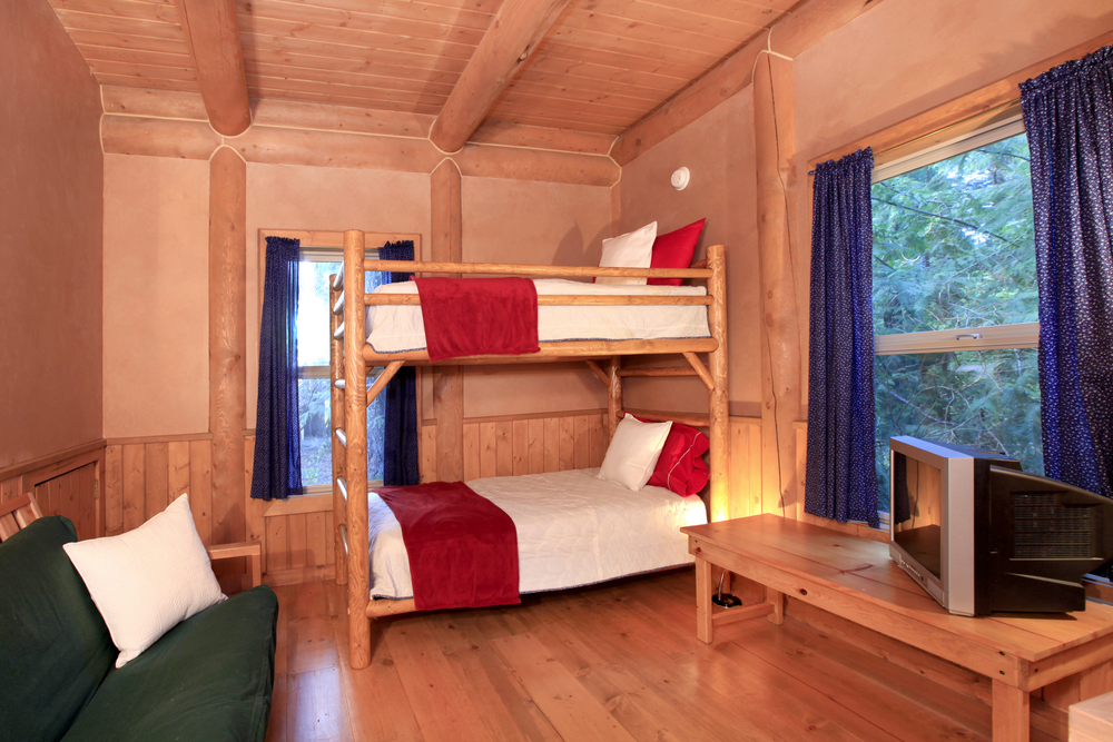 Log cabin bedroom with bunk bed/shed