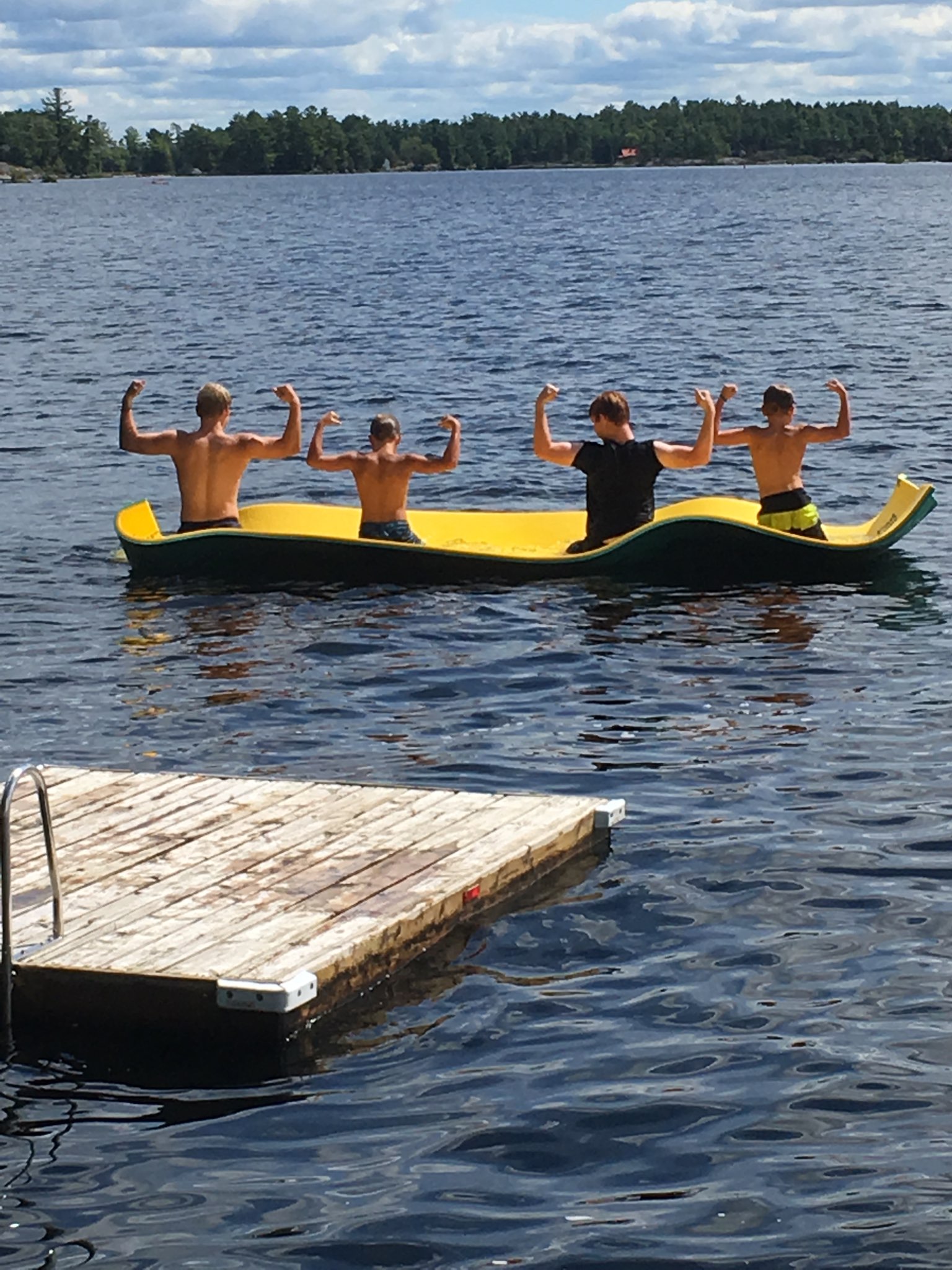 Boys on water mat flexing