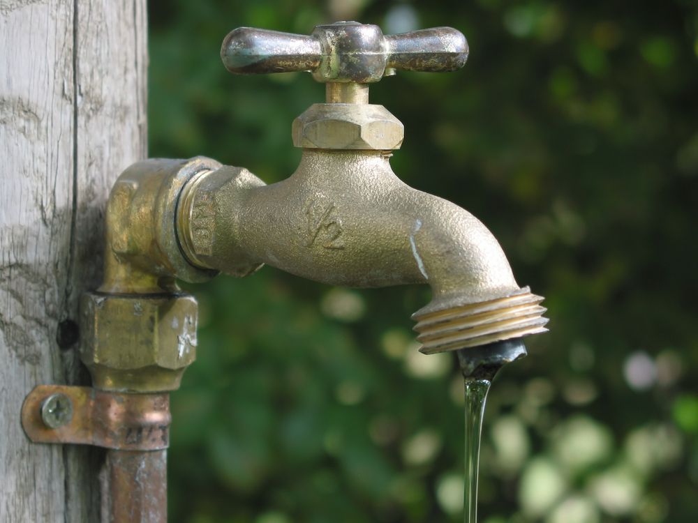 A leaky garden faucet, yard