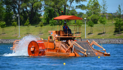 weed harvestor removing weeds from lake