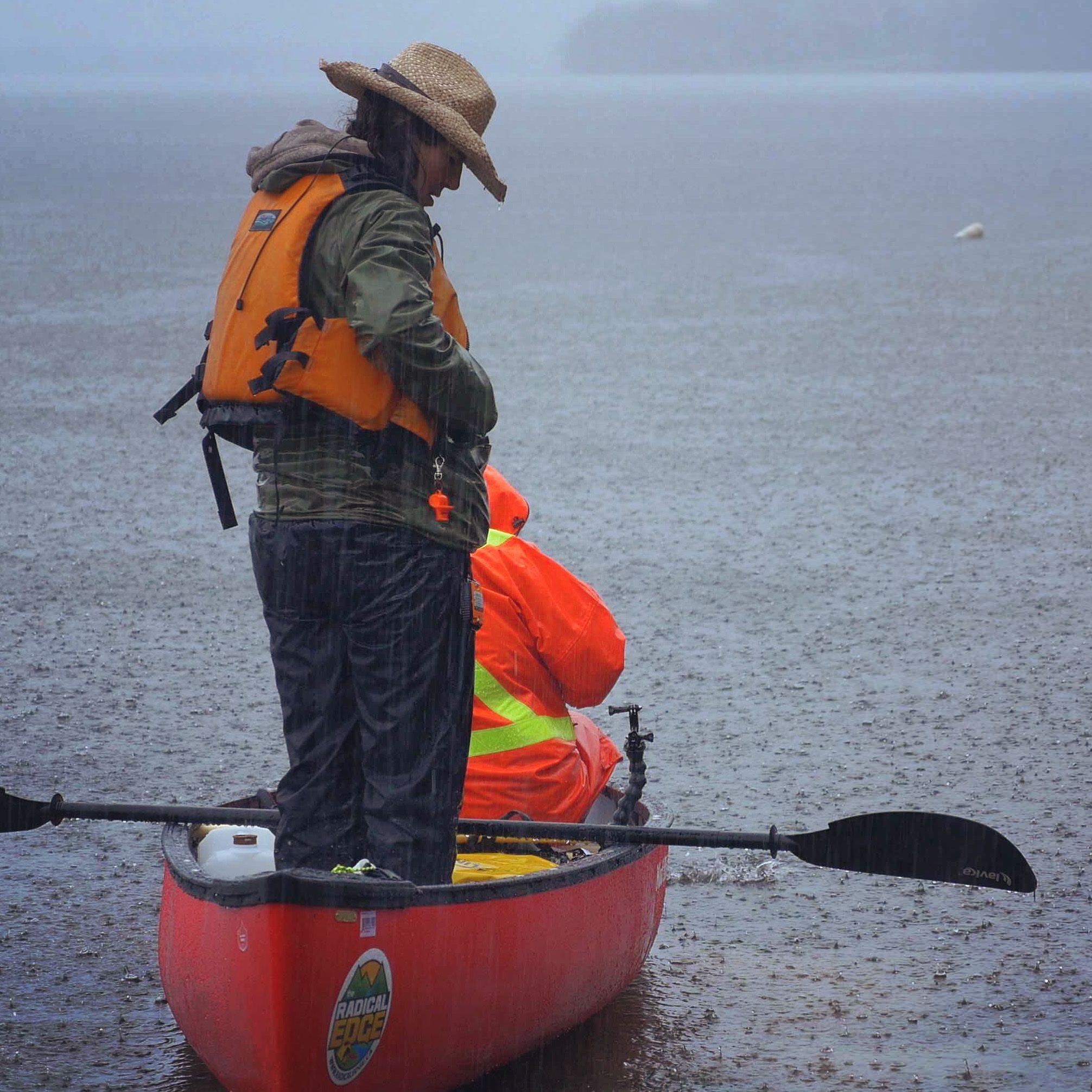 Dianne standing in her canoe in St. John river
