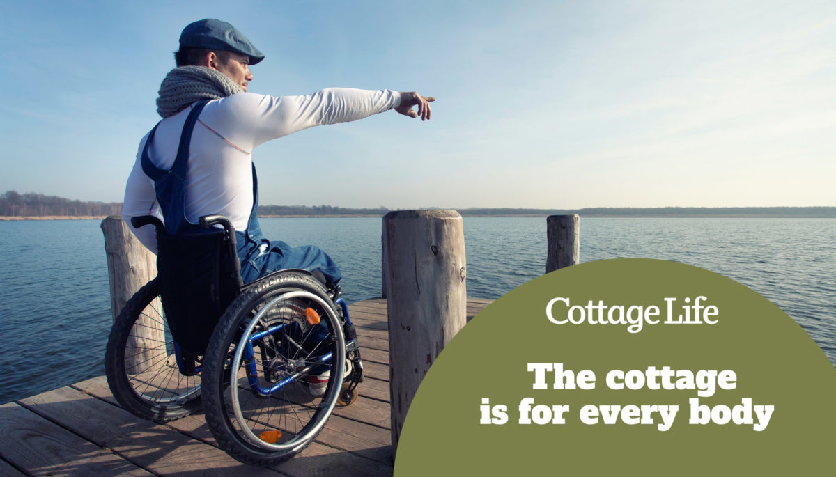 cheerful young man in wheelchair enjoying the spring on the lake