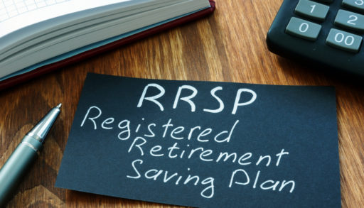 A black-and-white sign that reads RRSP Registered Retirement Saving Plan
