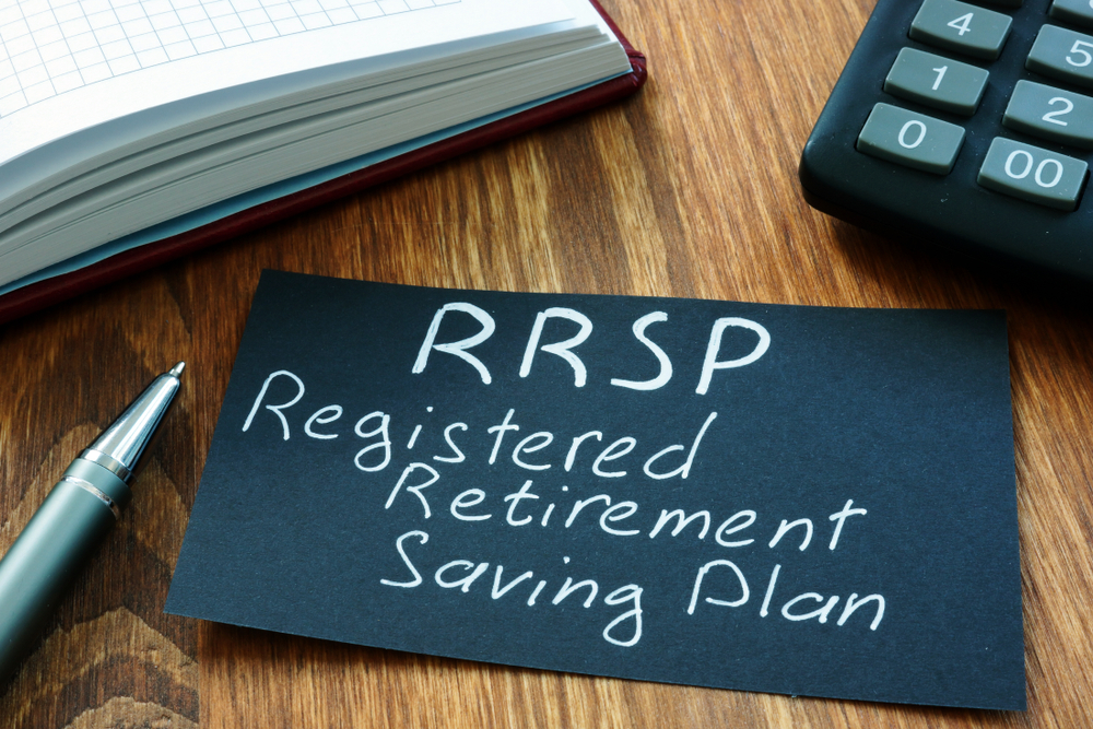 A black-and-white sign that reads RRSP Registered Retirement Saving Plan