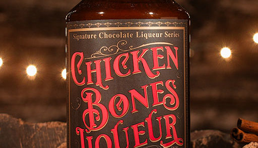 bottle of chicken bones liqueur on a wooden background