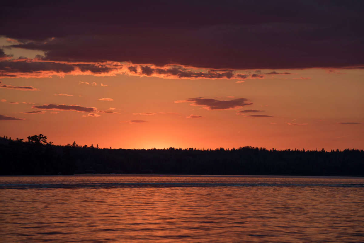 Scenic view of lake at dusk, Kenora, Lake of the Woods, Ontario, Canada.
