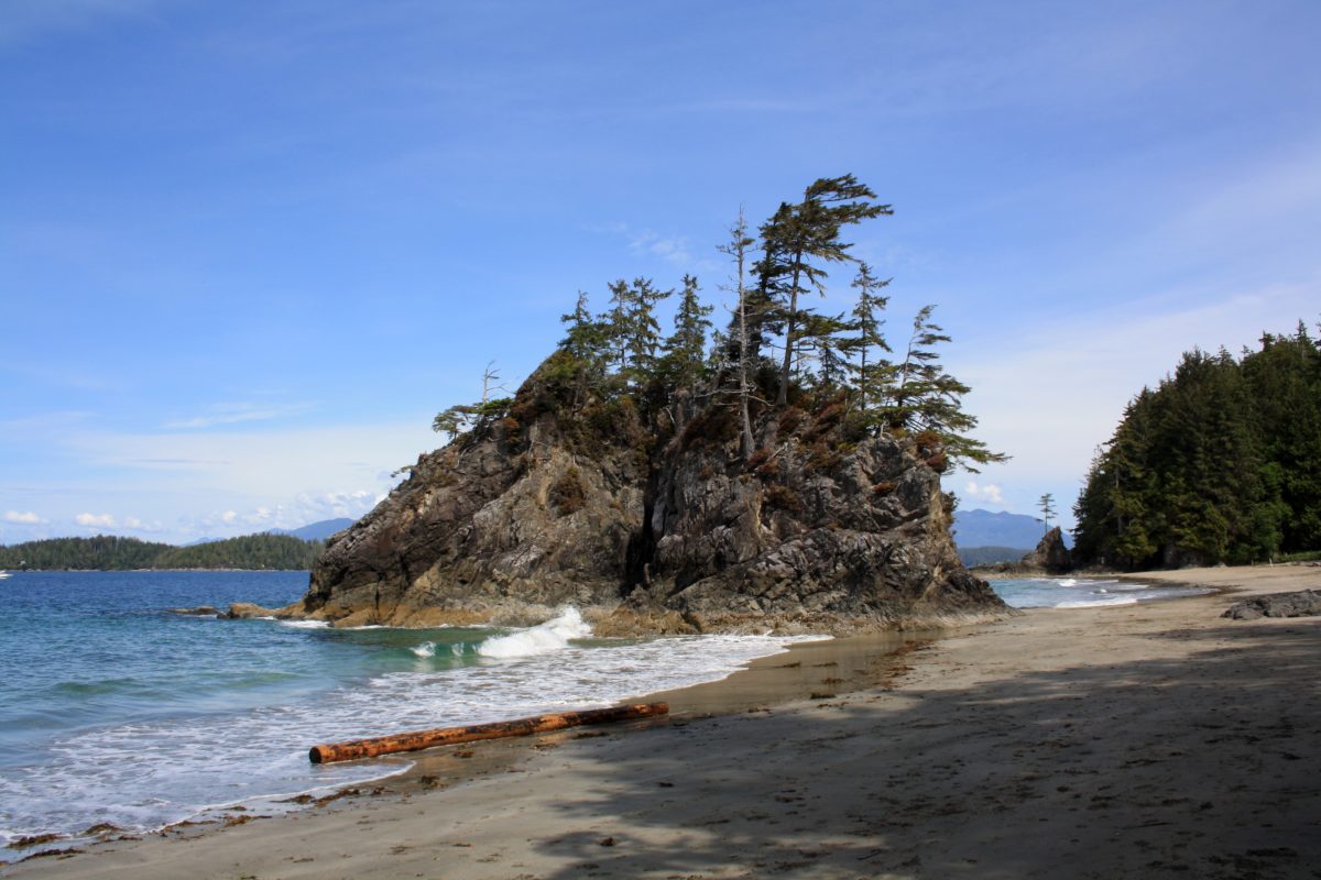 View of an ocean with a huge rock formation in Bamfield, British Columbia.