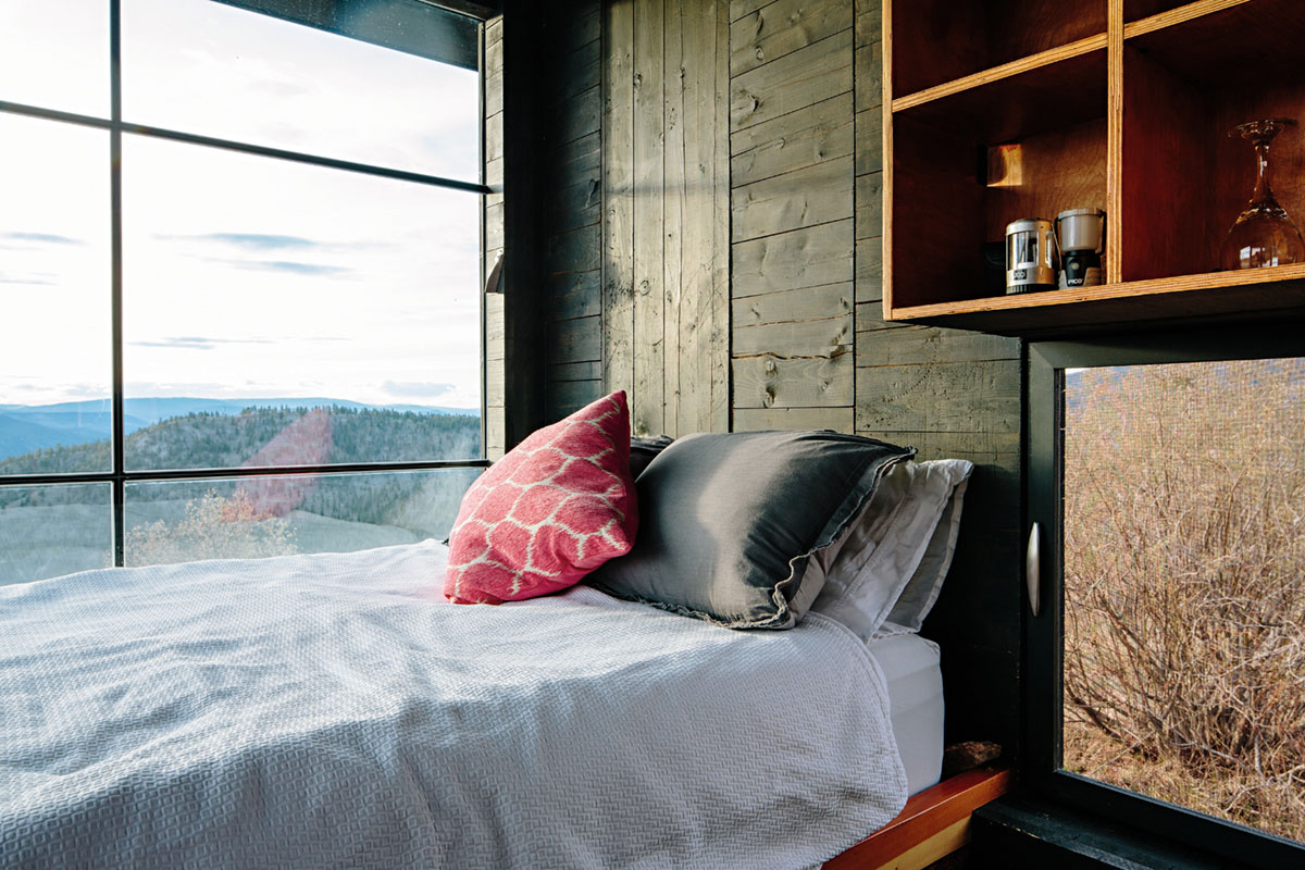 Bed overlooking the valley in the Rumspringa tiny cabin