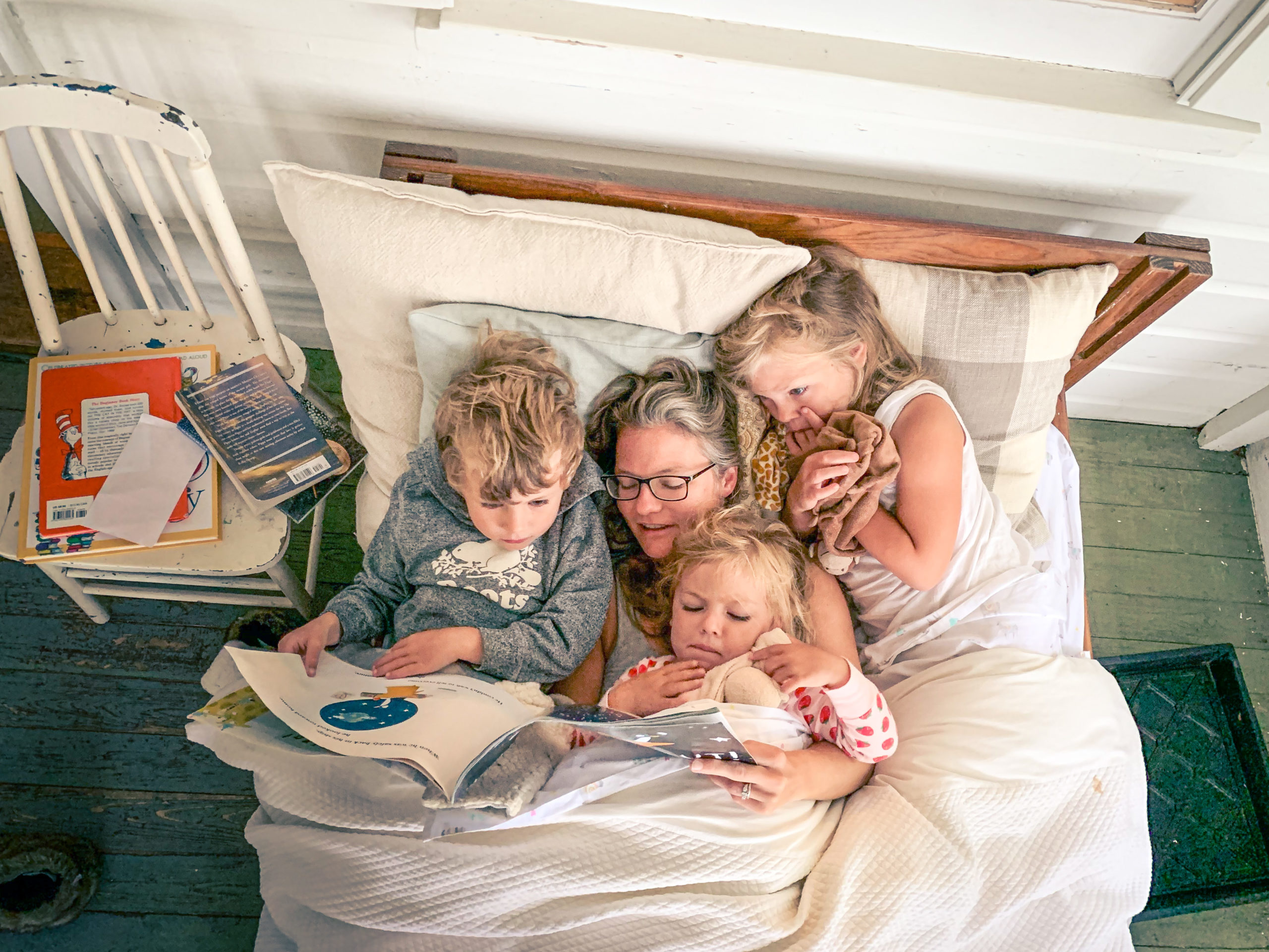 Family laying in day bed