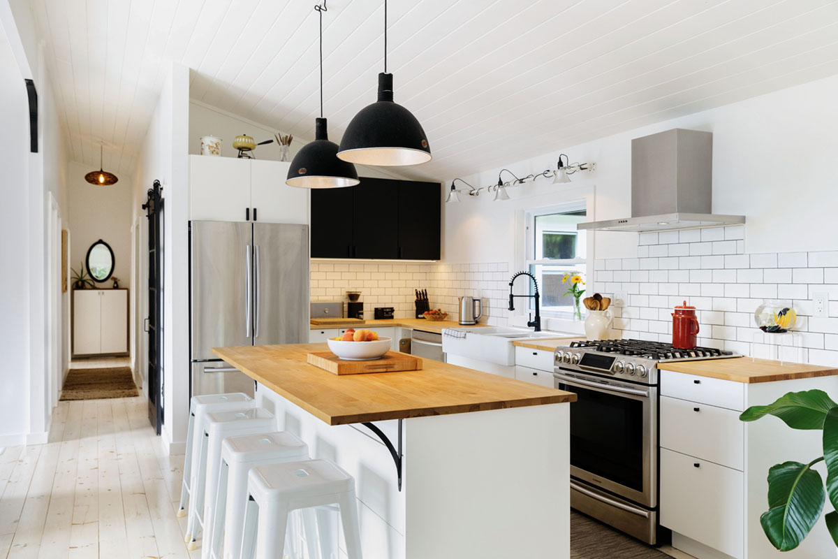 the white kitchen with black accents in Raina and Wilson's shared cottage