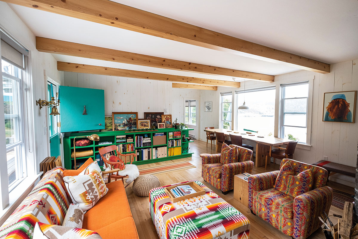 the living room of Pauline and Robbie's cottage heavy with prints and colours
