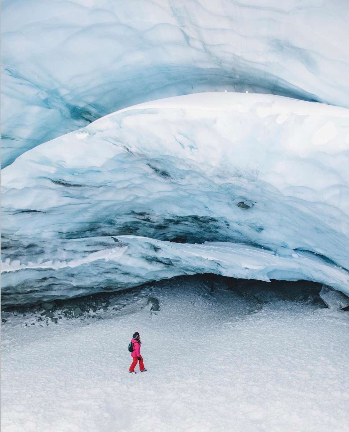 People exploring ice caves