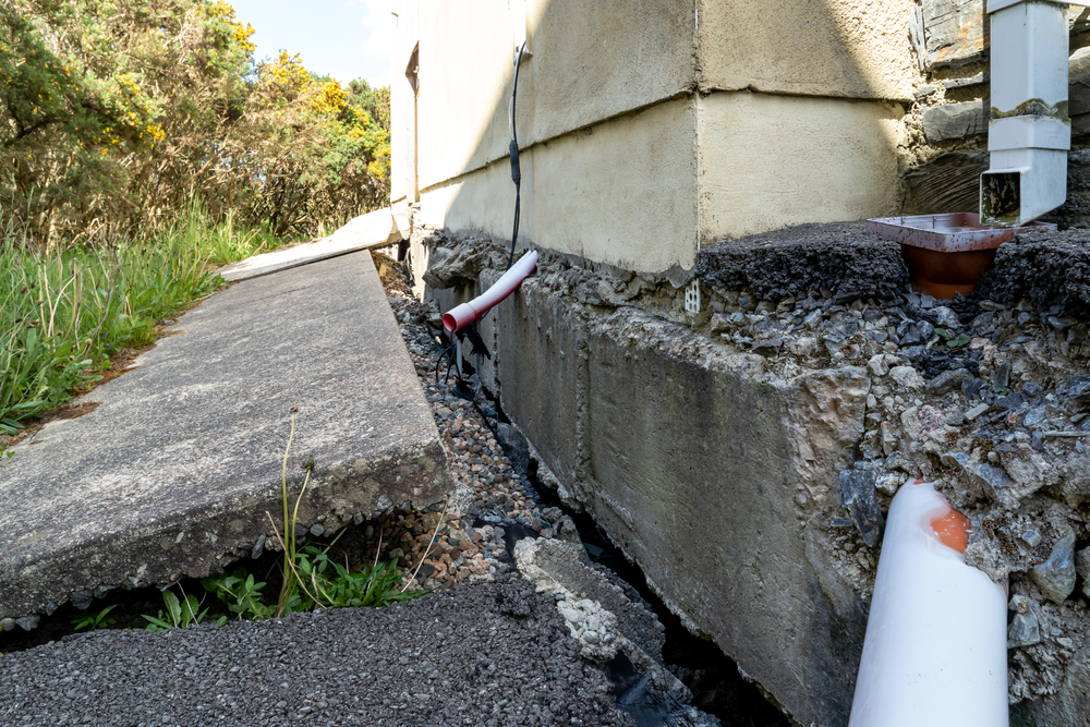 A house pulling away a concrete walkway