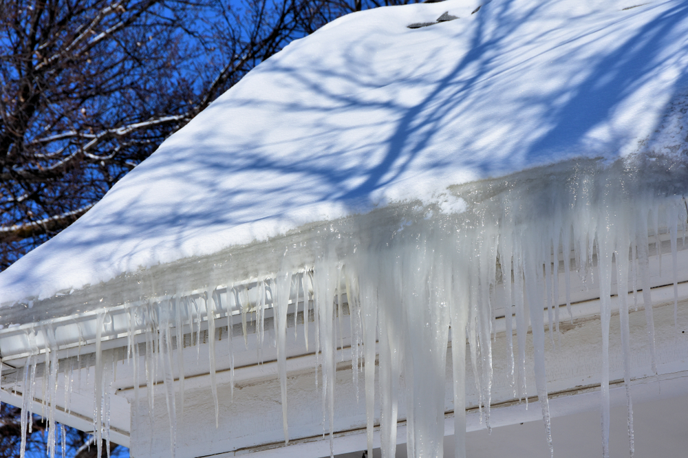 Icicles hanging off a room because of an ice dam