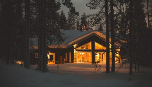 snowy cabin lit from within