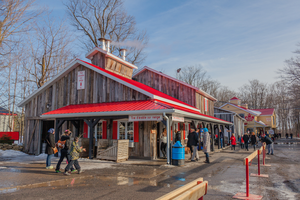People outside a sugar shack in Quebec