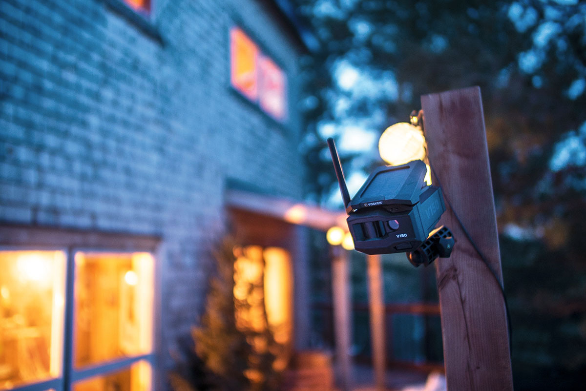 outdoor nighttime setting with the vosker security camera set up