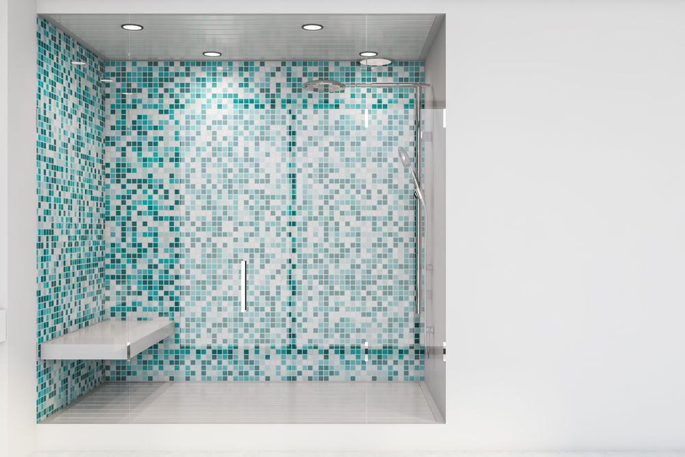 The interior of a large shower stall with built-in seat