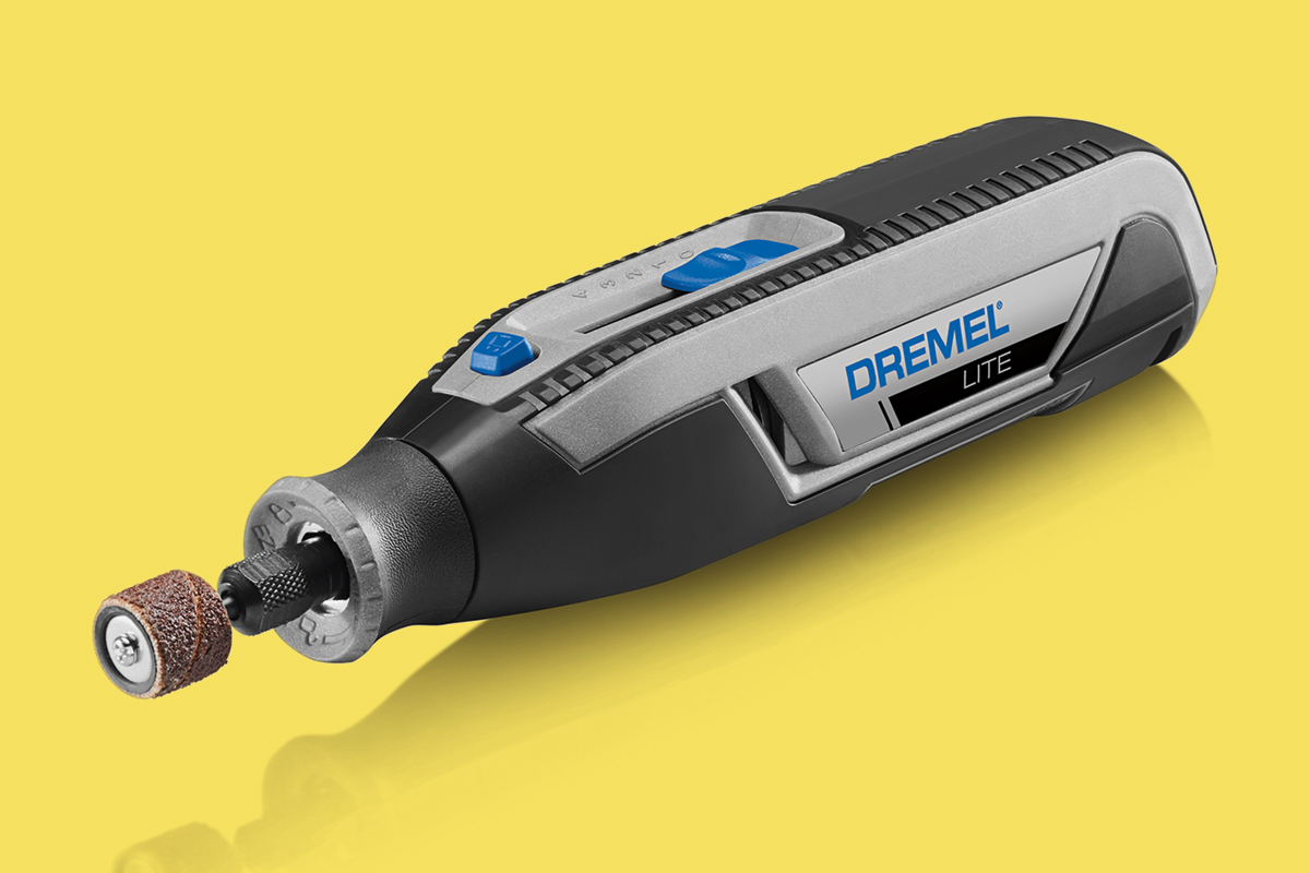 a dremel rotary tool on a yellow background
