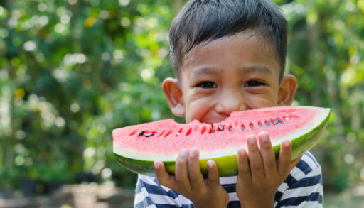 boy eating watermelon