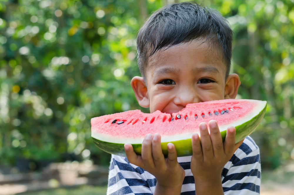 boy eating watermelon