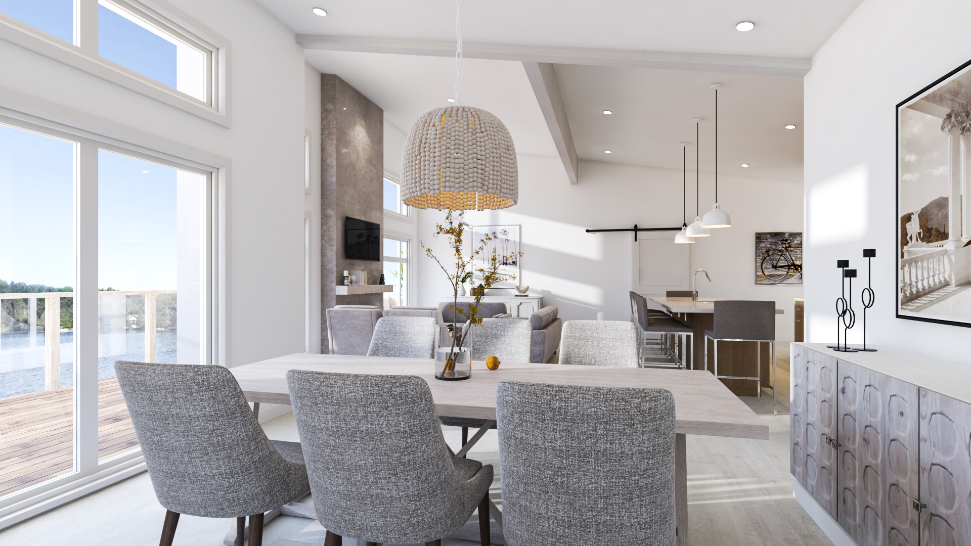 A table and grey chairs make up an open dining area that looks into the main living room.