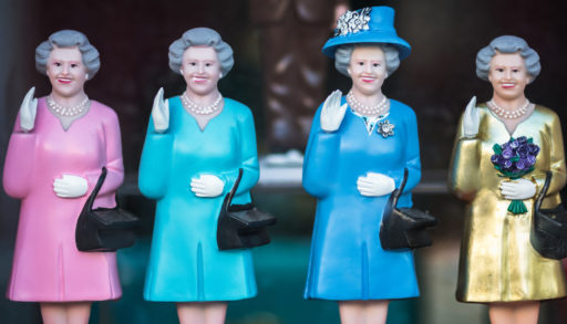 Four statues of Queen Elizabeth, waving.