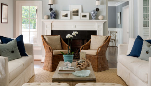 Newly designed classic style living room with blue/gray walls, mix of rustic and modern decor