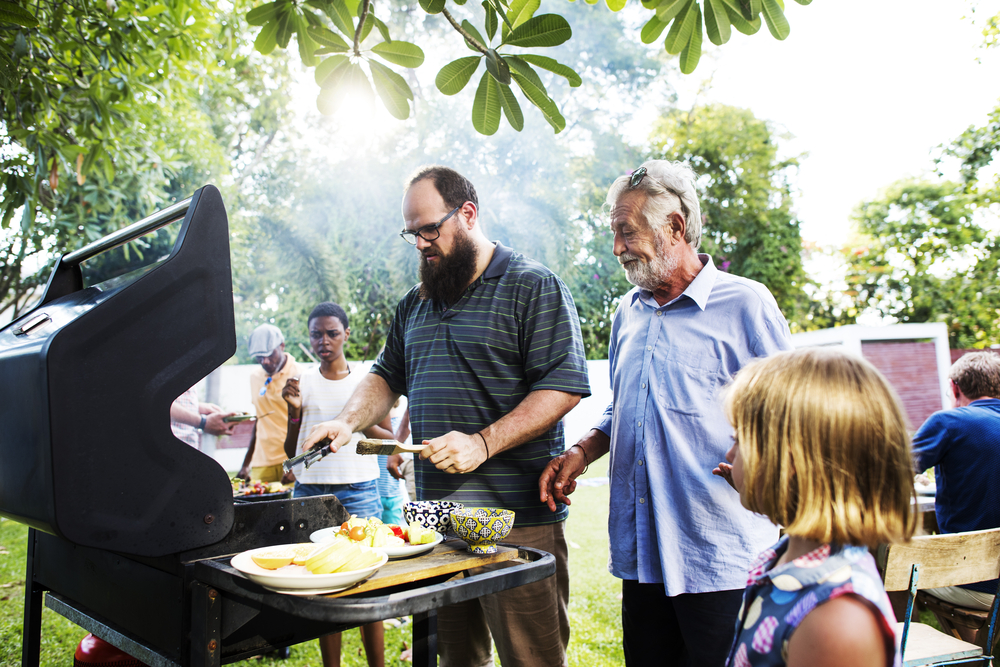 A group of people enjoying a barbecue