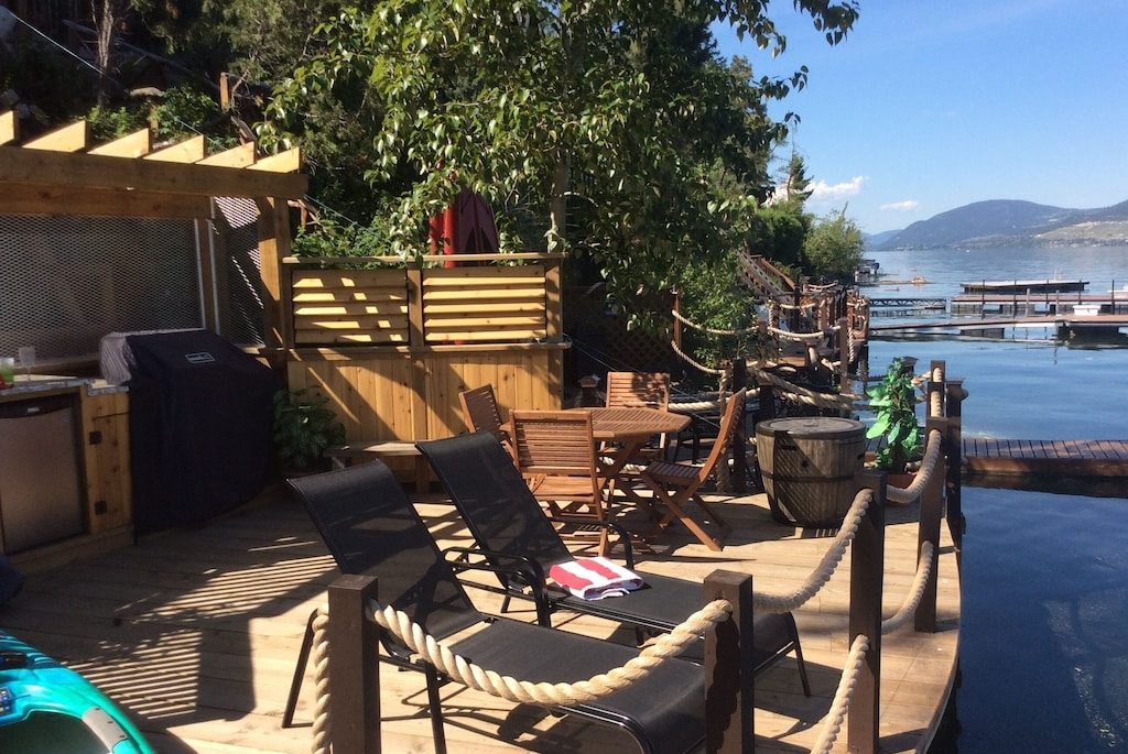 Deck with canoe and lounge chairs