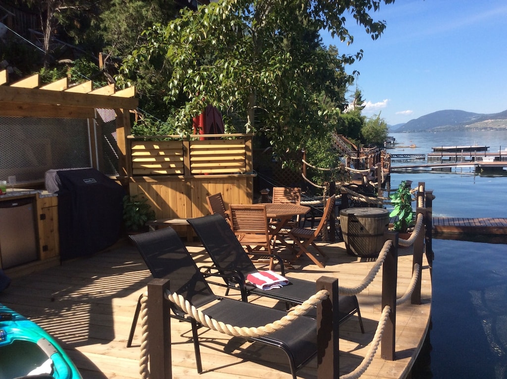 Deck with canoe and lounge chairs
