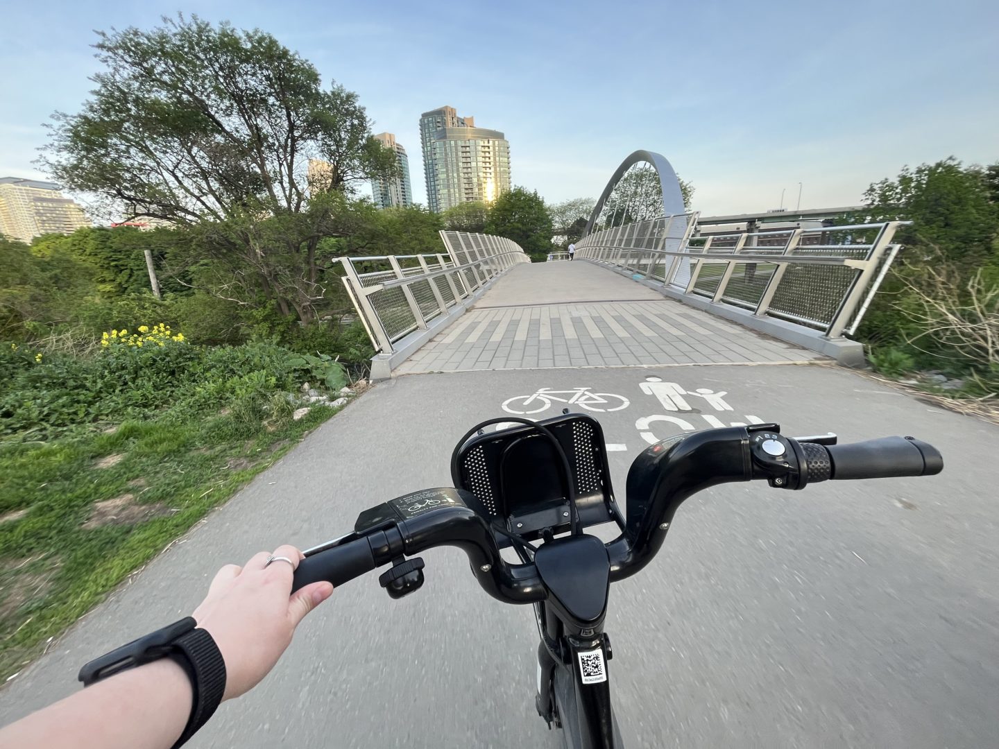 Bike travelling along bike path over bridge.