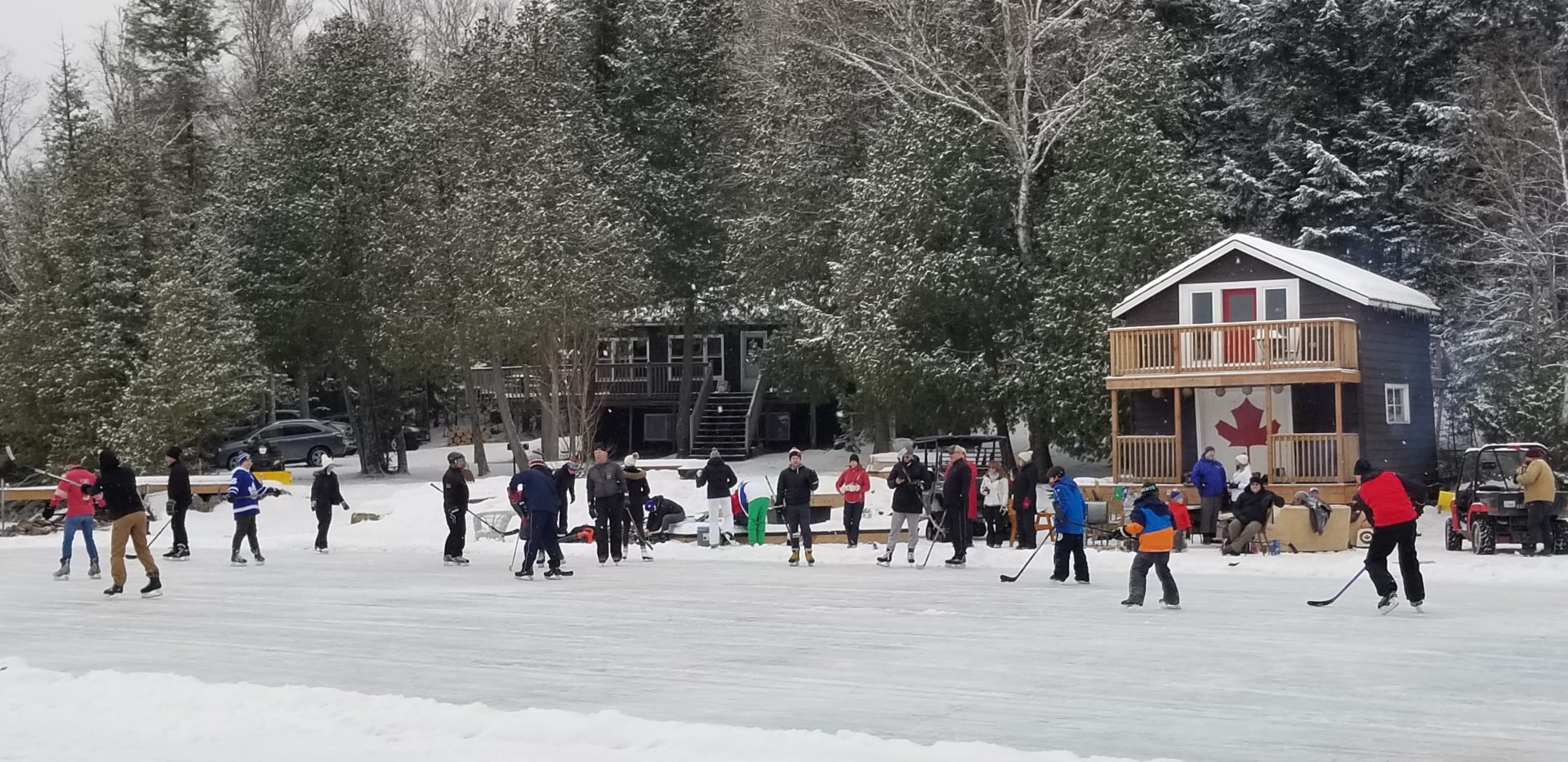 Photo contest entry of multiple families playing hockey on a frozen lake.
