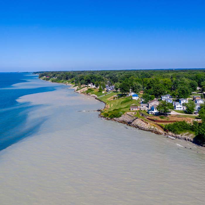 July 14th 2019 Lake Erie, Ohio: Due to record high water levels, Large amounts of sand and silt are being washed out, causing part of the lake to have a tan colour