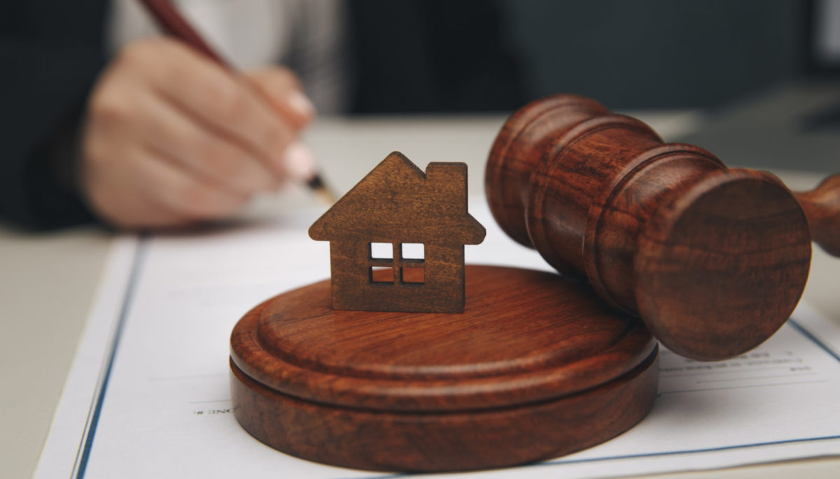 Model of house and a gavel.