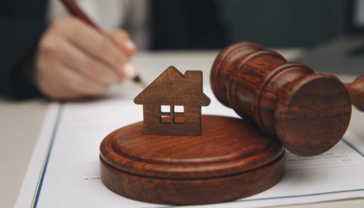 Model of house and a gavel.
