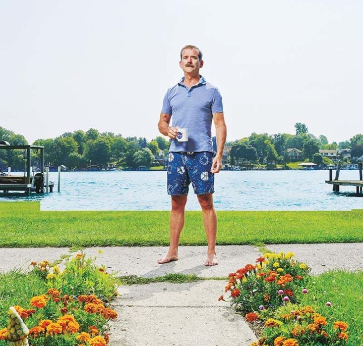 Chris Hadfield stands in front of the St. Clair River, where his cottage is located