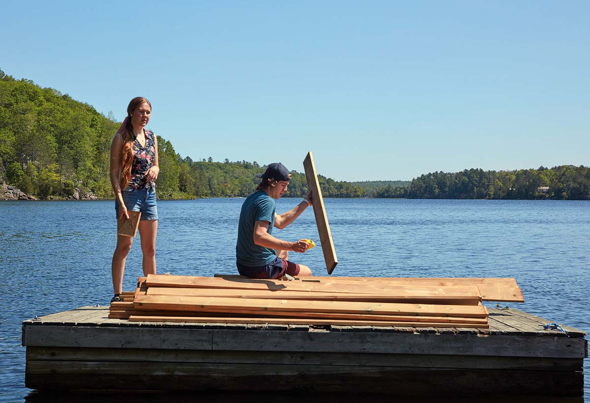 Sam and Simon sit on their dock.
