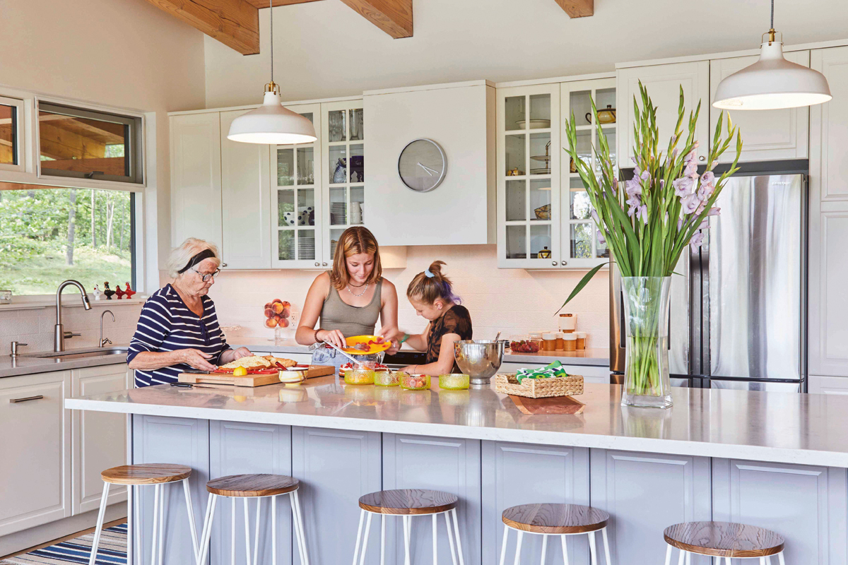The Kelars in the open concept kitchen making food